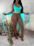 Leopard one-piece swimsuit with matching sarong cover-up, turquoise/sky blue front