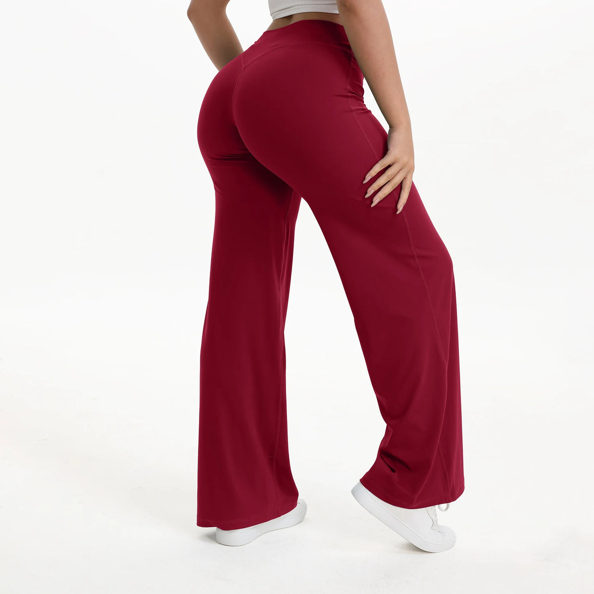 ruby red mid waist straight leg yoga pants on model