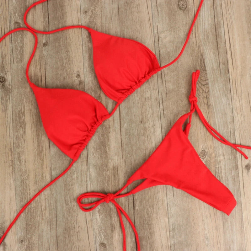 red push up triangle bikini set with thong bottom on wood floor