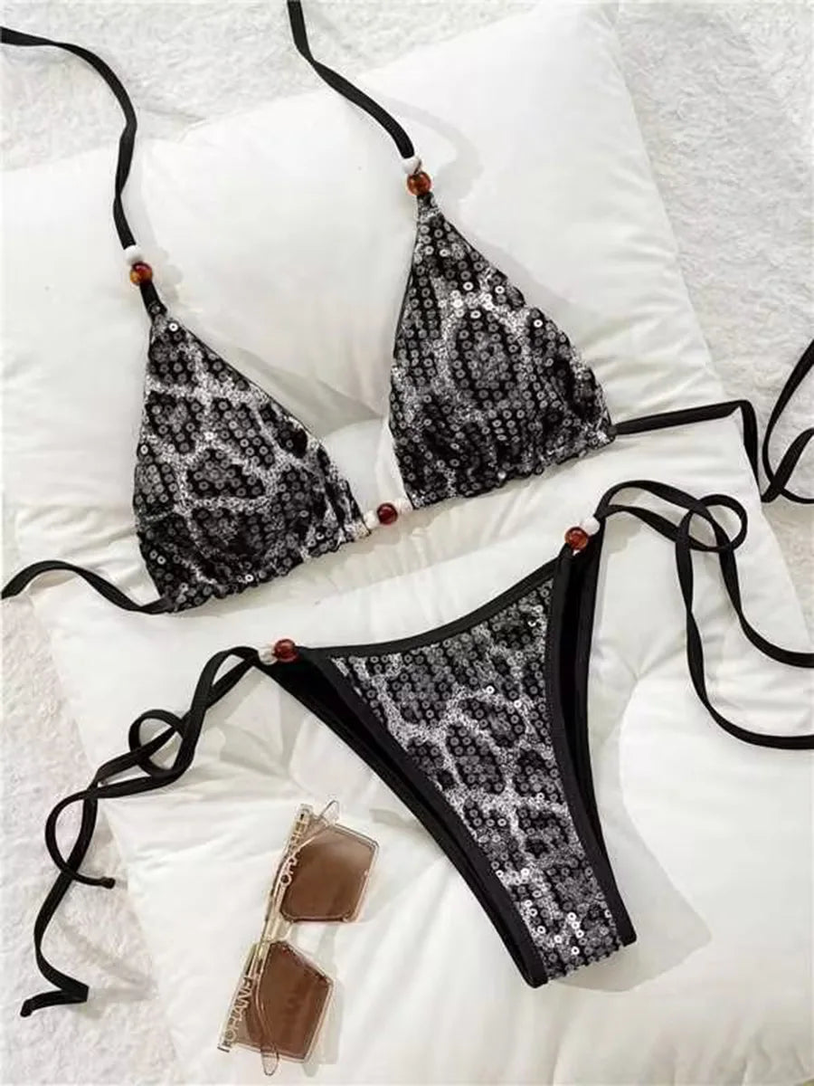 black leopard sequin bikini set laid flat with strappy ties
