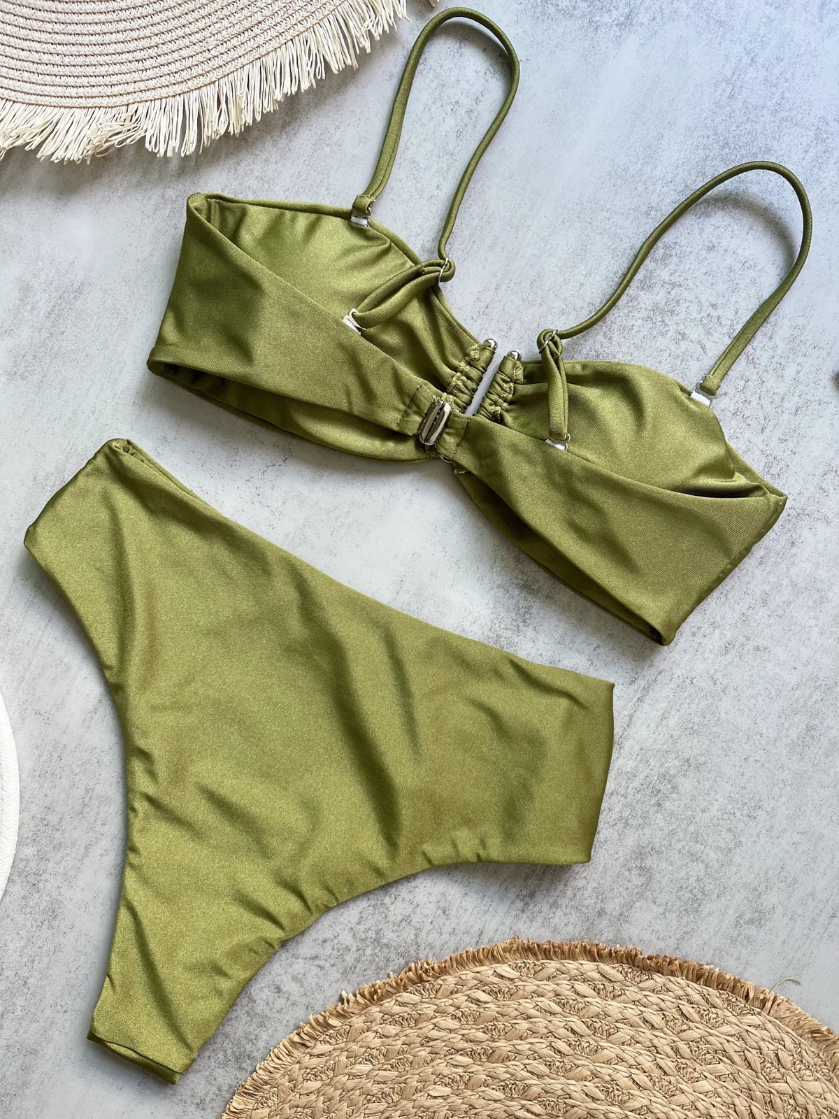 Olive green ruched bandeau top and Brazilian bikini bottom set from a low angle