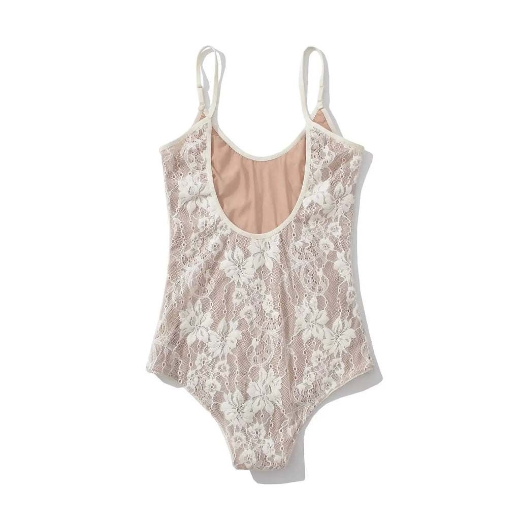 White floral lace bodysuit laid flat, back view with nude lining panel visible