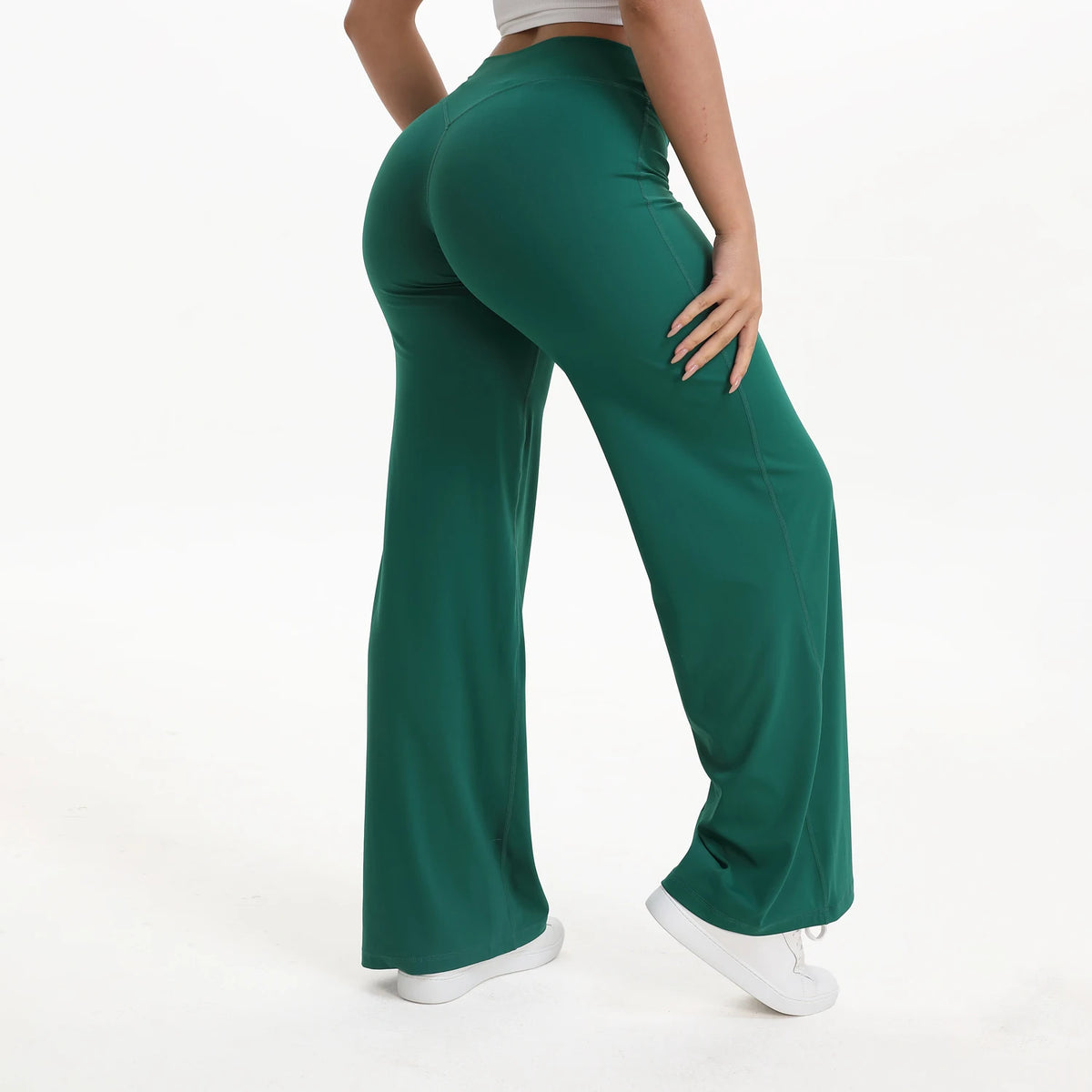 forest green mid waist straight leg yoga pants on model