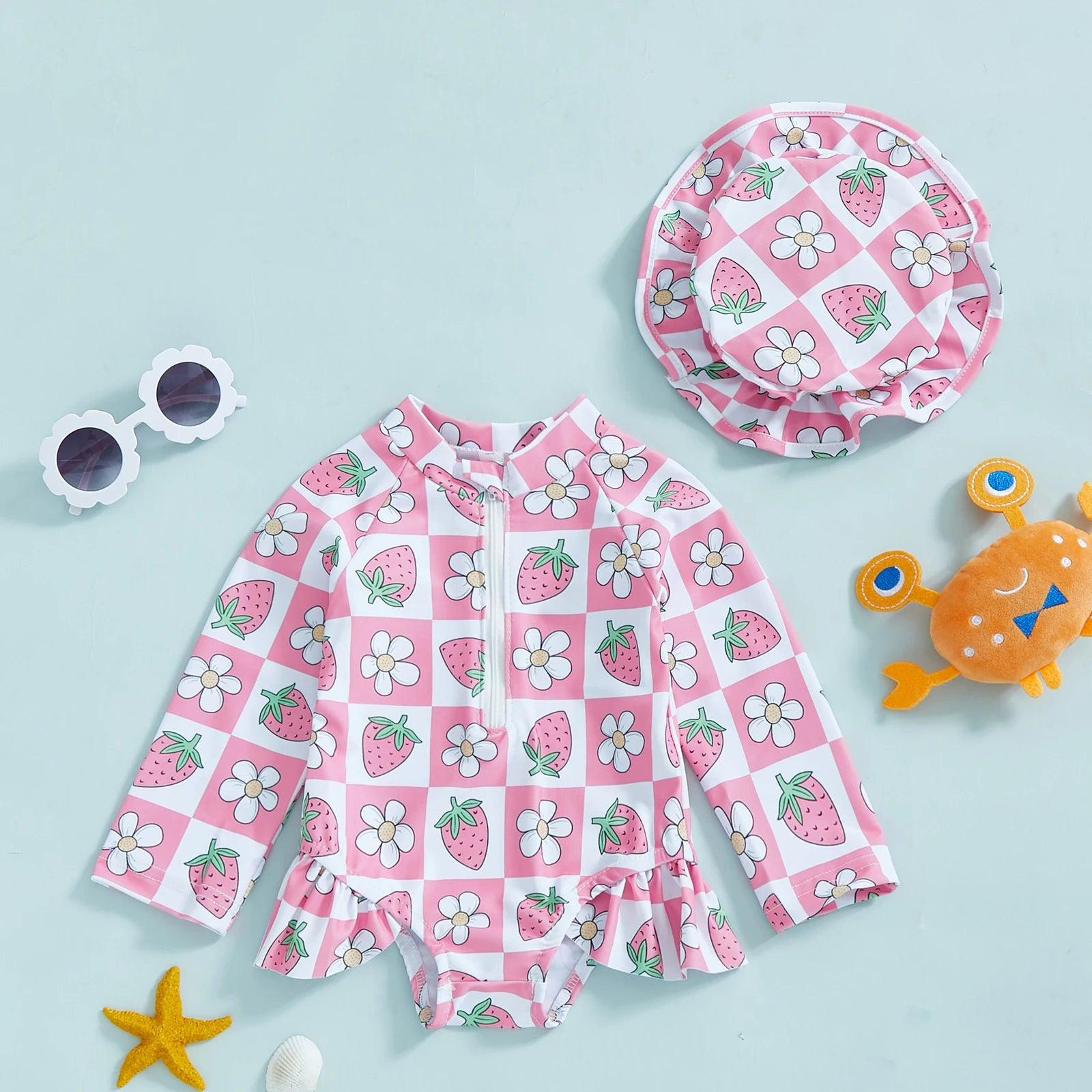 Toddler girls long-sleeve rash guard swimsuit with pink strawberry and white daisy pattern and ruffled hem with hat