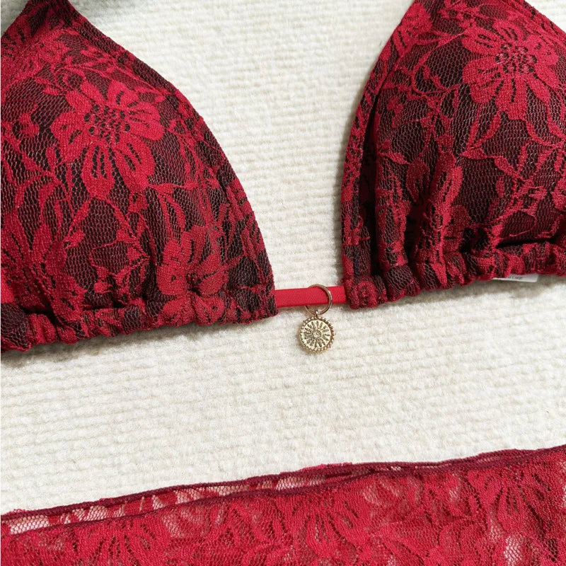 red lace triangle bikini top close up with gold medallion tie
