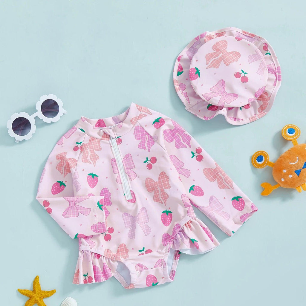 Toddler girls long sleeve rash guard swimsuit in pink strawberry with bow pattern and ruffled hem with hat