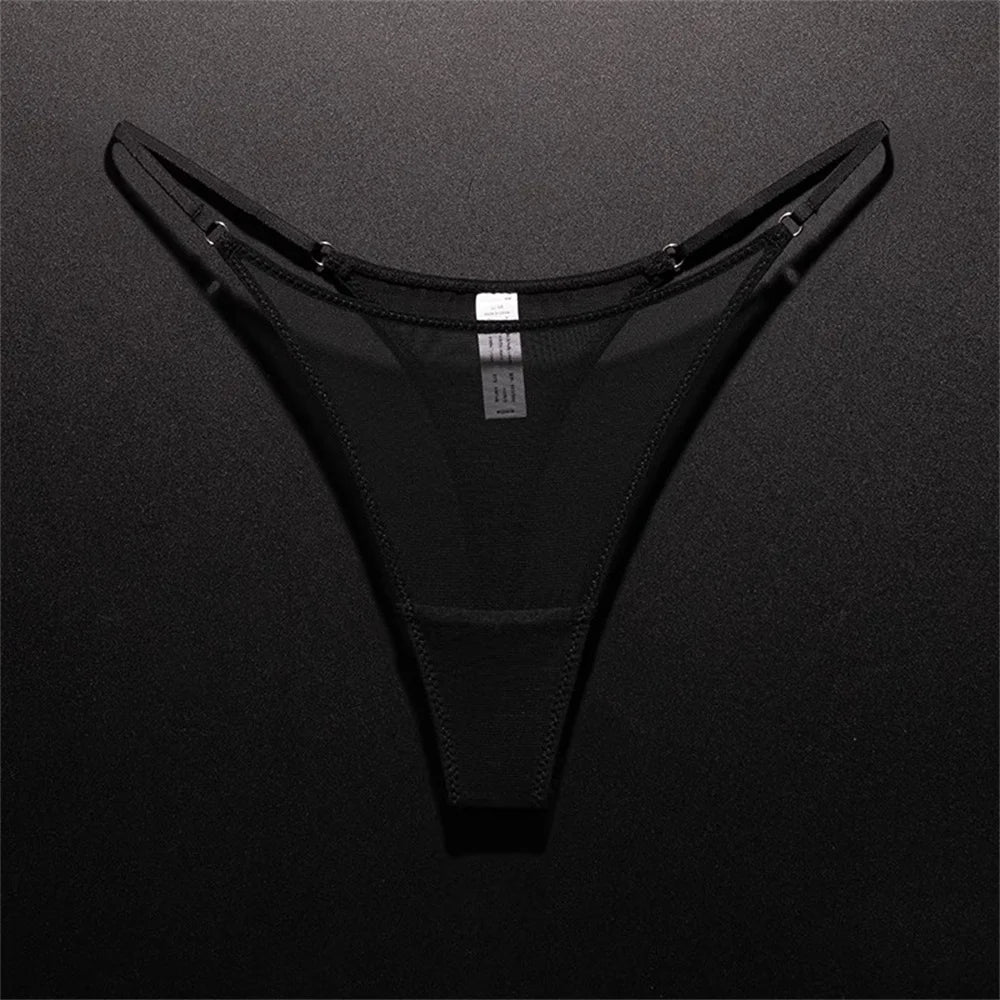 black seamless mesh thong underwear laid flat on dark background