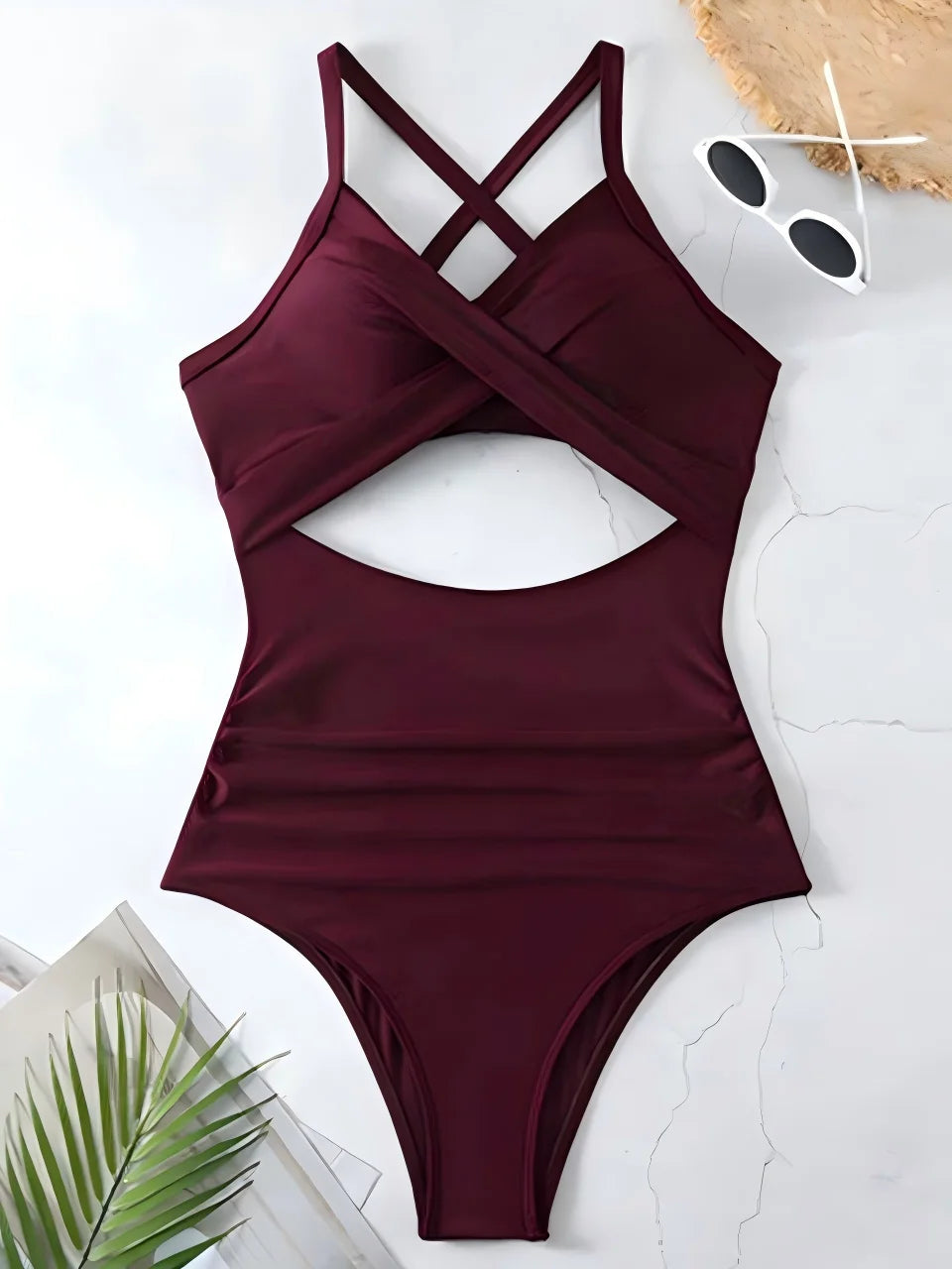 burgundy cross strap ruched one piece swimsuit with cutout bodice laid flat