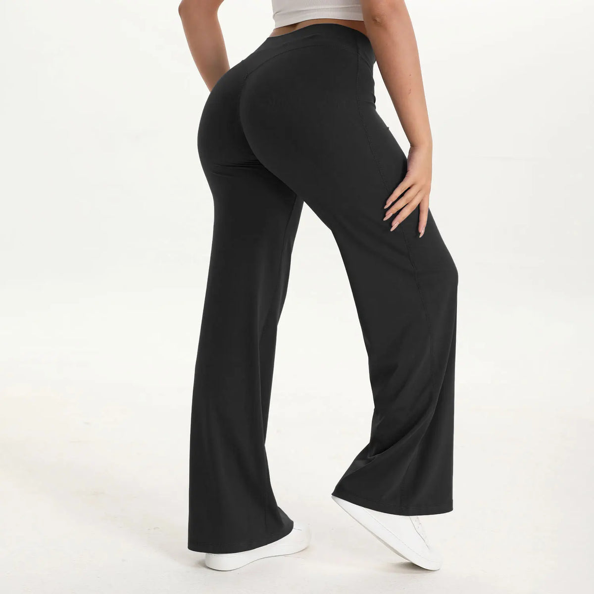 midnight black mid waist straight leg yoga pants on model