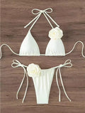White halter string bikini set with 3D rose on the top and matching bottom with bow straps
