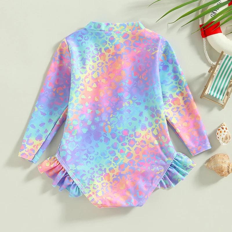 Baby girls fish scale long sleeve mermaid swimsuit with vibrant rainbow leopard print and ruffled hem and cuffs