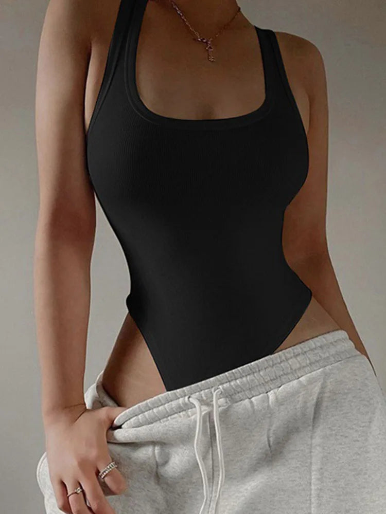 Black sleeveless knit bodysuit, front view on model with drop waist sweatpants