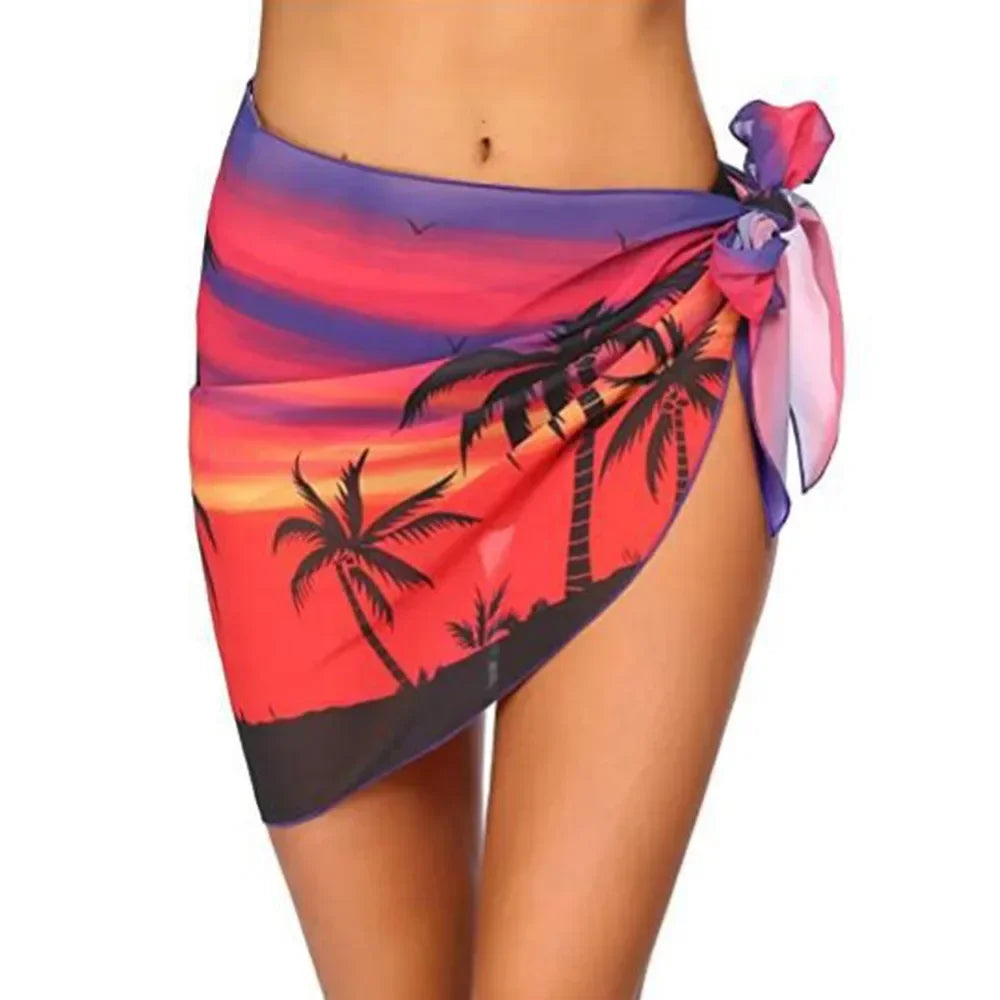 model wearing an orange sunset palm print chiffon sarong wrap