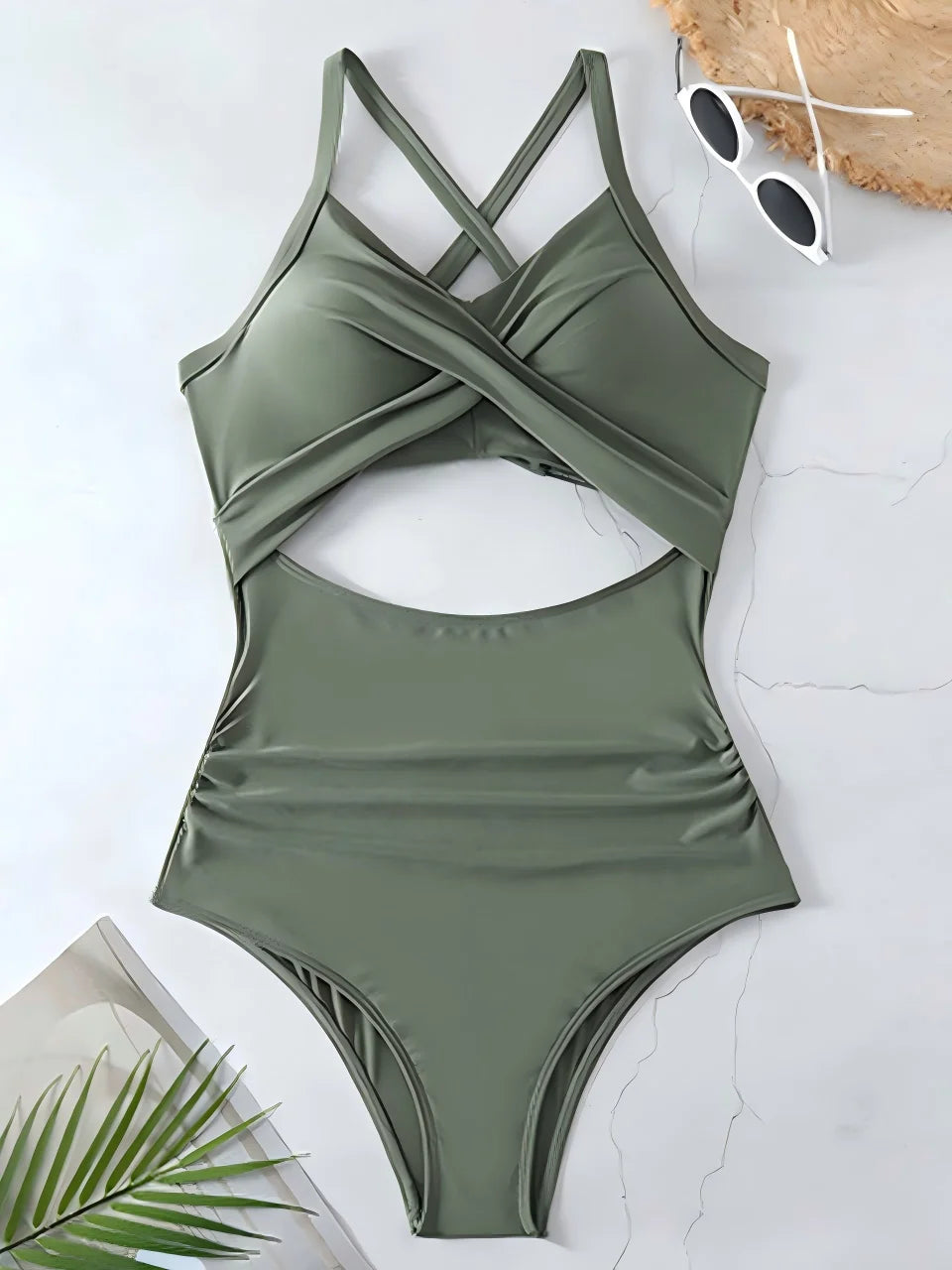 olive green cross strap ruched one piece swimsuit with cutout bodice laid flat