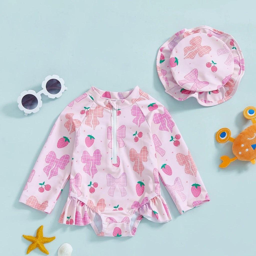 Toddler girls long sleeve rash guard swimsuit in pink strawberry print with bow pattern and ruffled hem with hat