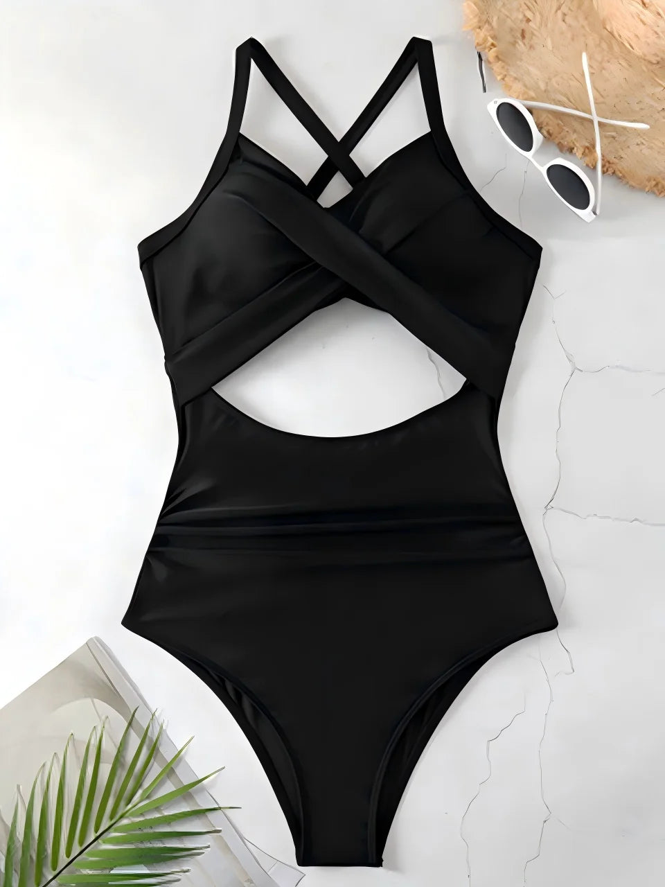 black cross strap one piece swimsuit with cutout bodice laid flat