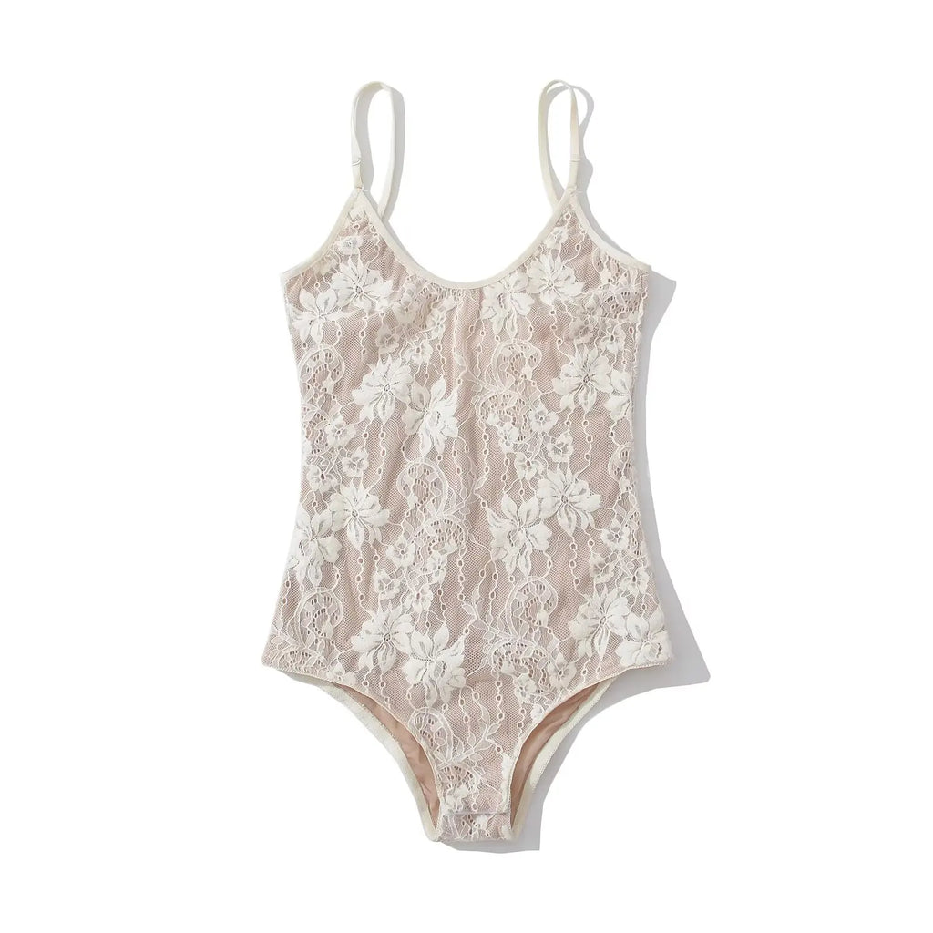 White floral lace bodysuit laid flat, sheer floral lace front with built-in lining