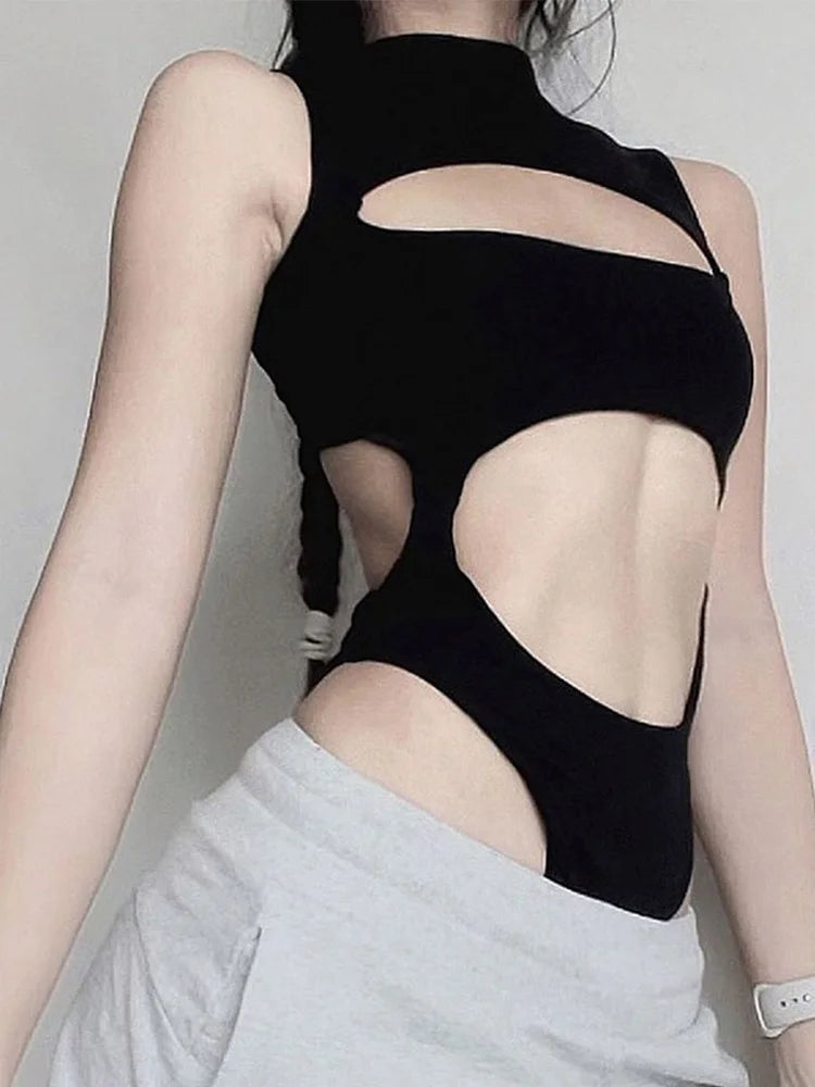 Side view of black cut out bodysuit showing the open back and mock neck