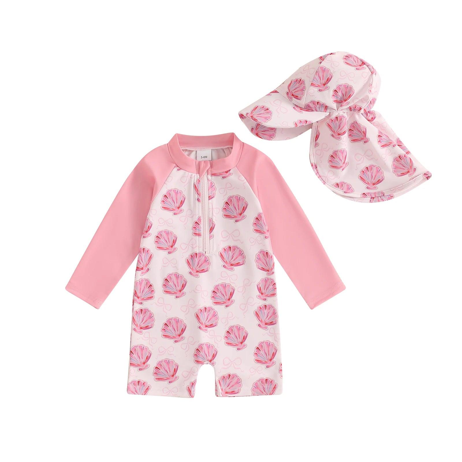 Toddler floral tropical long sleeve swimsuit with sun hat in pink seashell pattern for sun protection at the beach