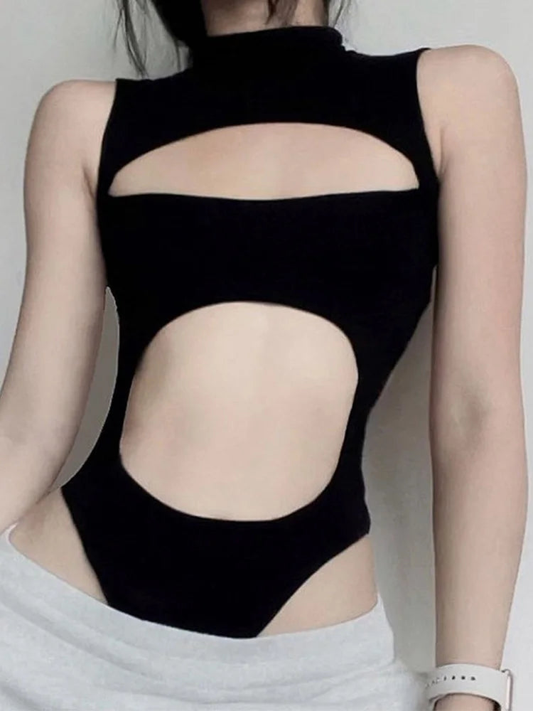 Black mock neck cut out bodysuit on a woman, front view with oval chest and midsection cutouts
