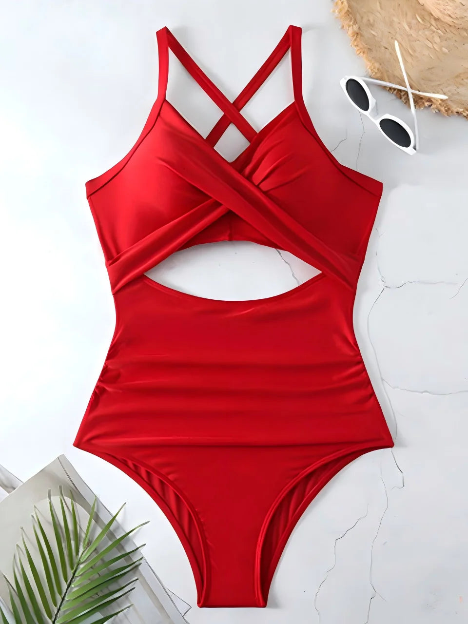 red cross strap ruched one piece swimsuit with cutout bodice laid flat