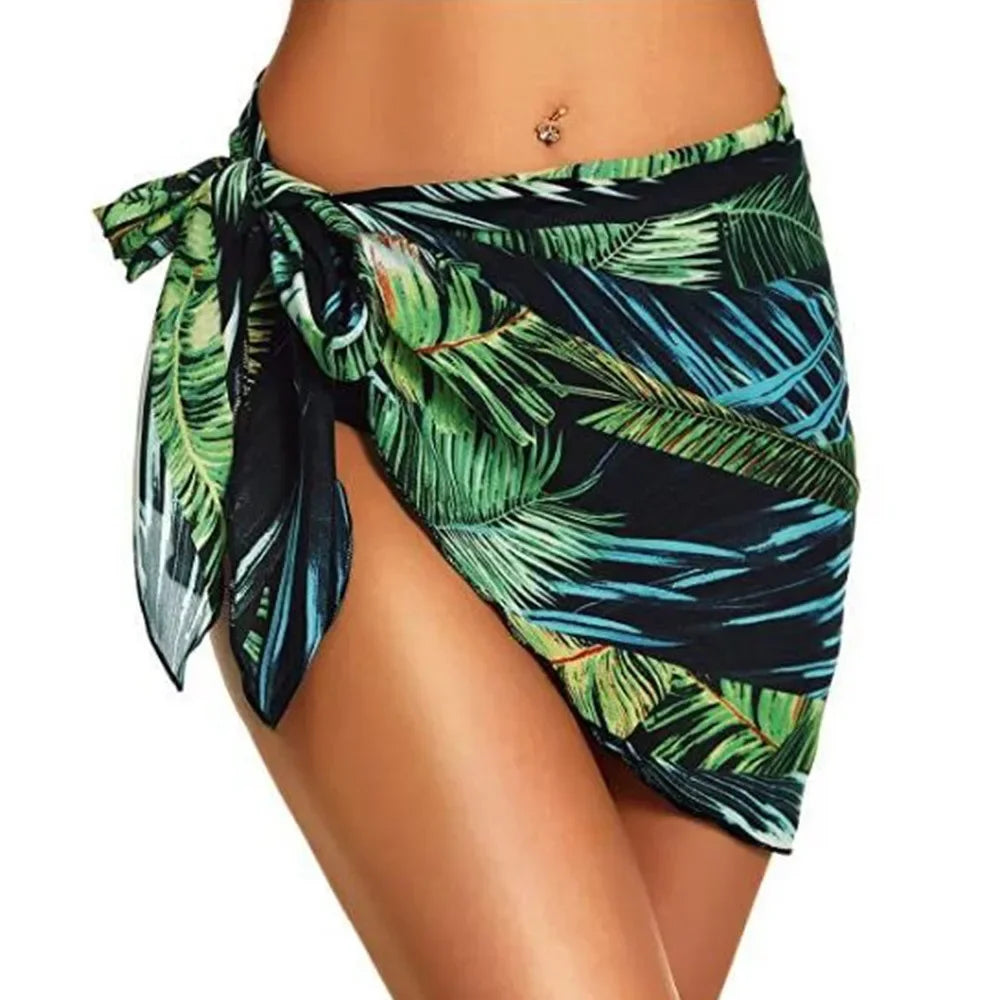 model wearing a green tropical leaf print chiffon sarong wrap