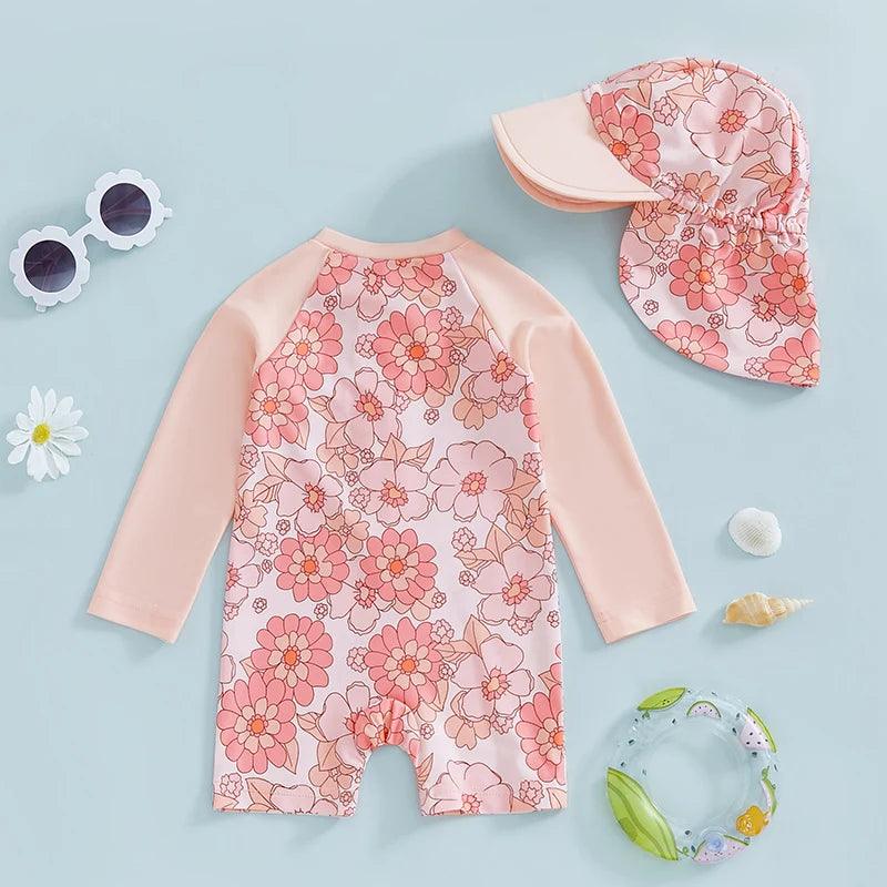 Toddler girls long-sleeve floral swim suit with peach sleeves and matching sun hat for sun protection