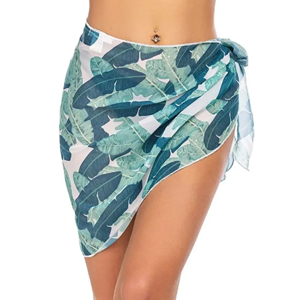 model wearing a blue tropical leaf print chiffon sarong wrap