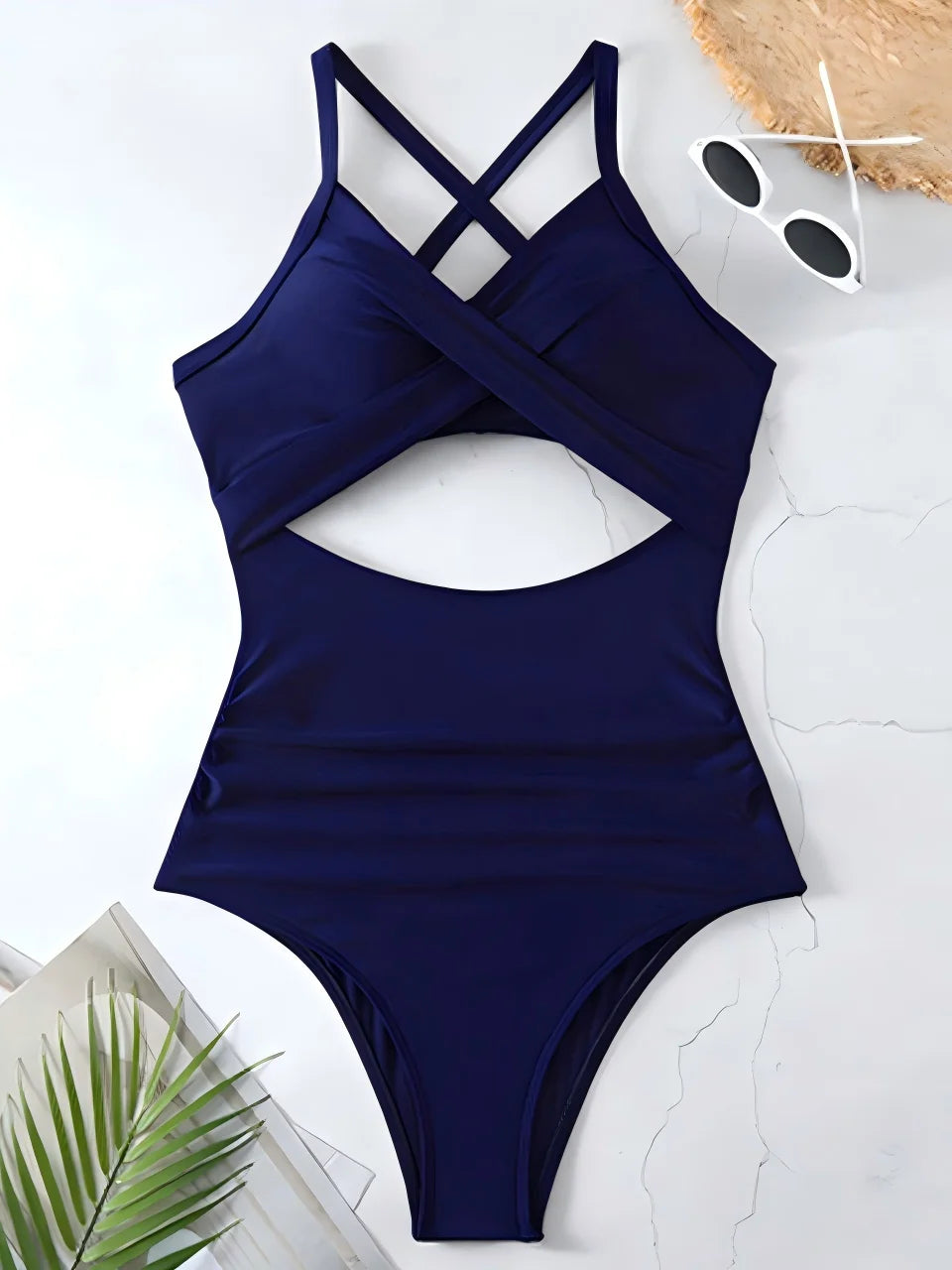 navy blue cross strap ruched one piece swimsuit with cutout bodice laid flat