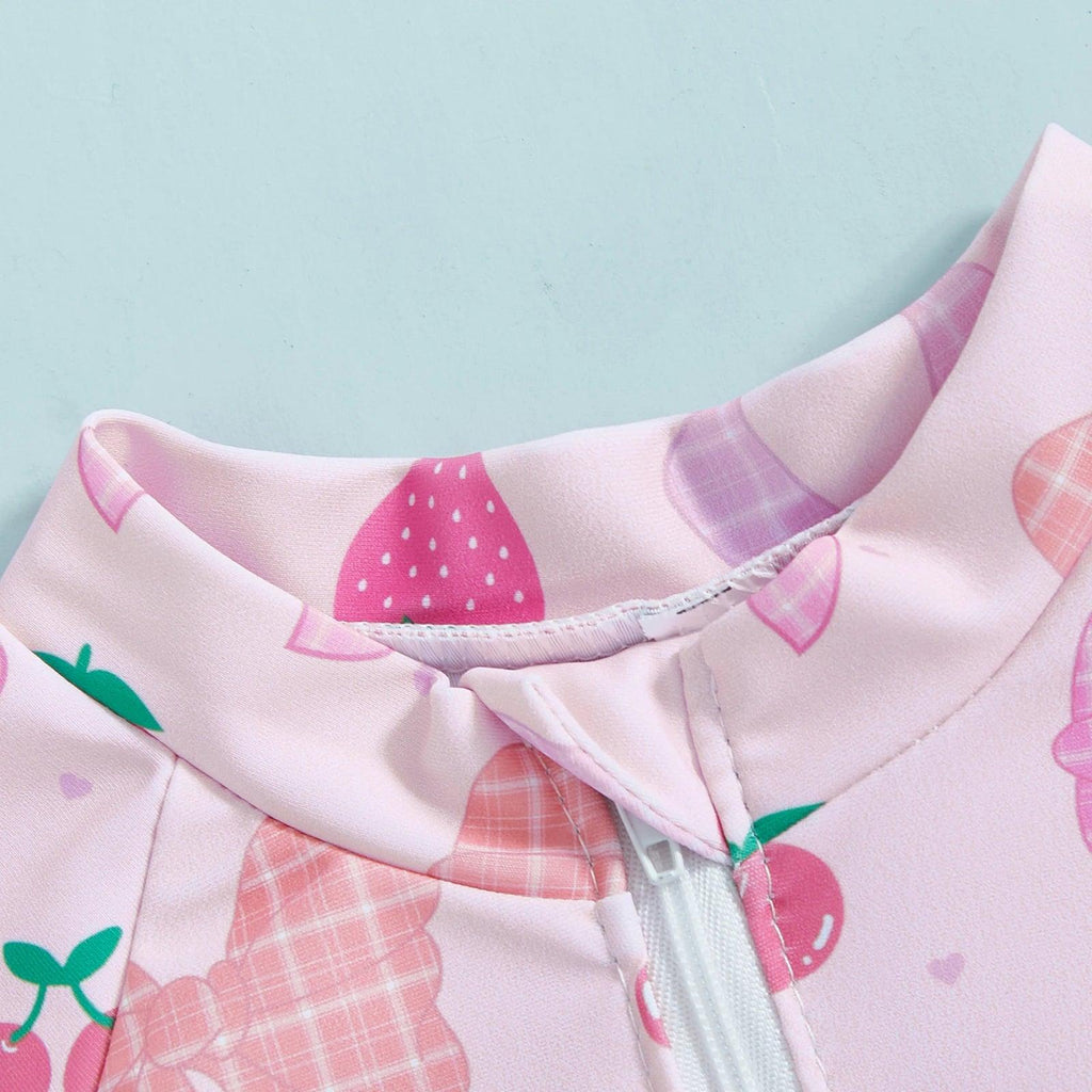 Toddler girls long sleeve rash guard swimsuit with hat featuring pink strawberry and cherry print and soft smooth fabric