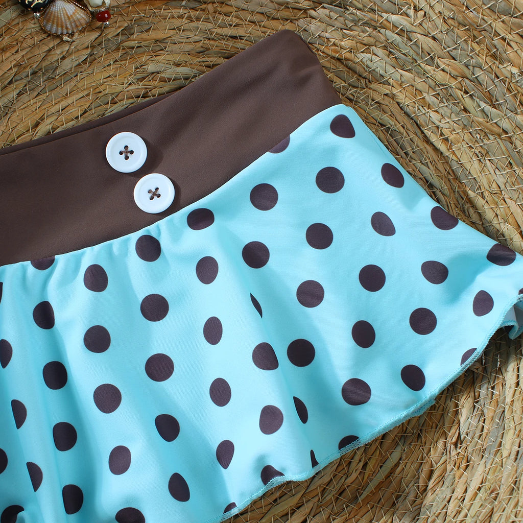 close up of cyan polka dot ruffle mini pants bikini bottom with brown button waistband