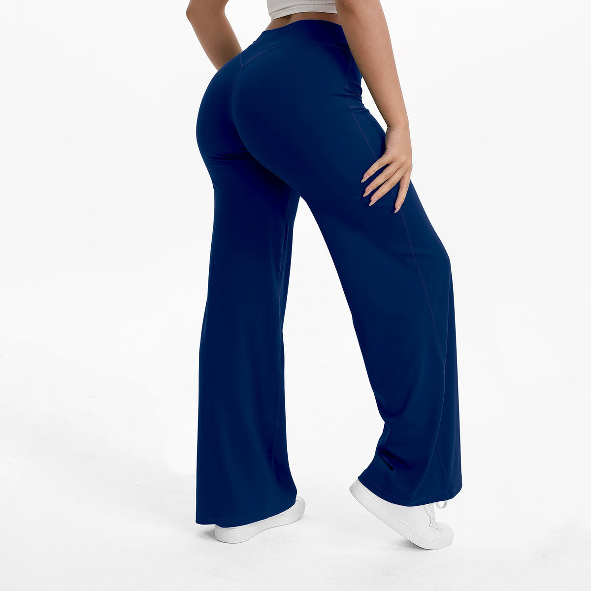 ink blue mid waist straight leg yoga pants on model
