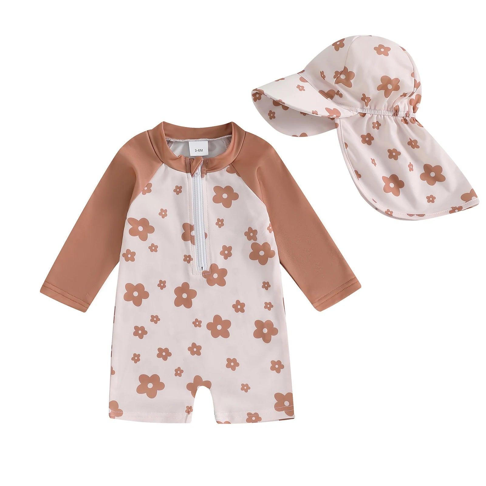 Toddler floral tropical long sleeve swimsuit in soft beige with brown sleeves and matching floral sun hat in terracotta tones