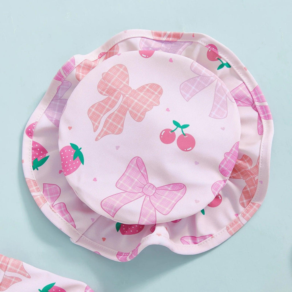 Toddler girls long sleeve rash guard swimsuit with pink bucket hat featuring bows cherries and strawberries pattern