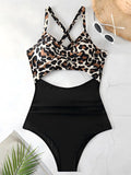 leopard print cross strap top with black body ruched one piece swimsuit laid flat
