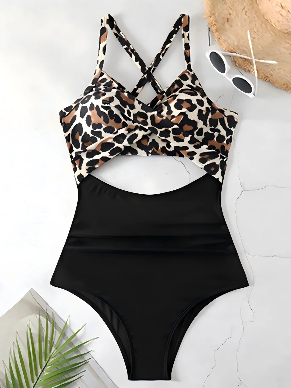 leopard print cross strap top with black body ruched one piece swimsuit laid flat
