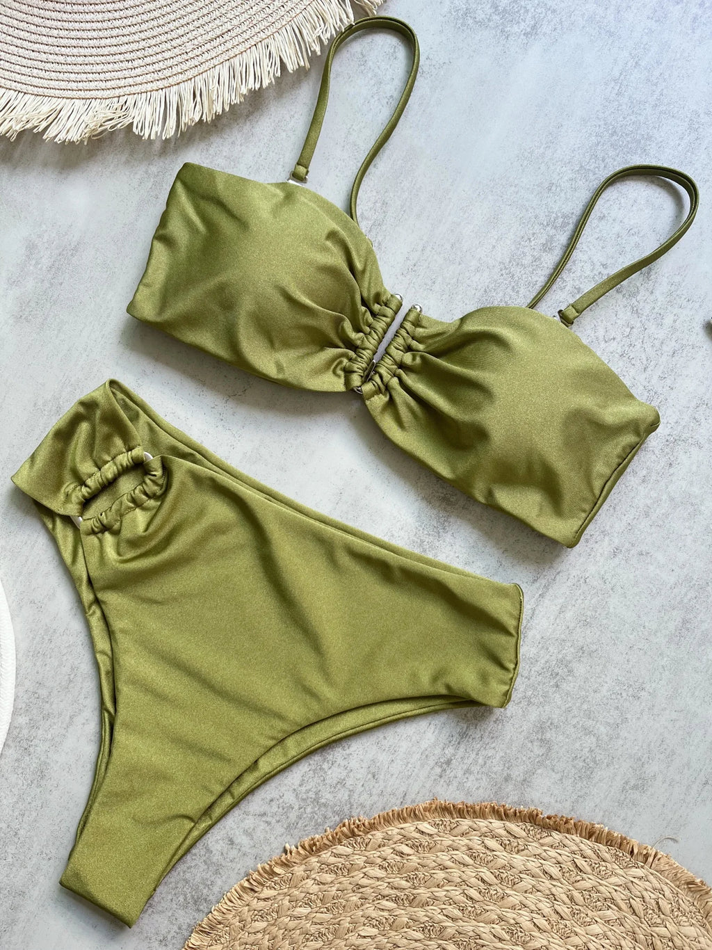 Olive green bandeau push up bikini set with ruched center front on marble surface