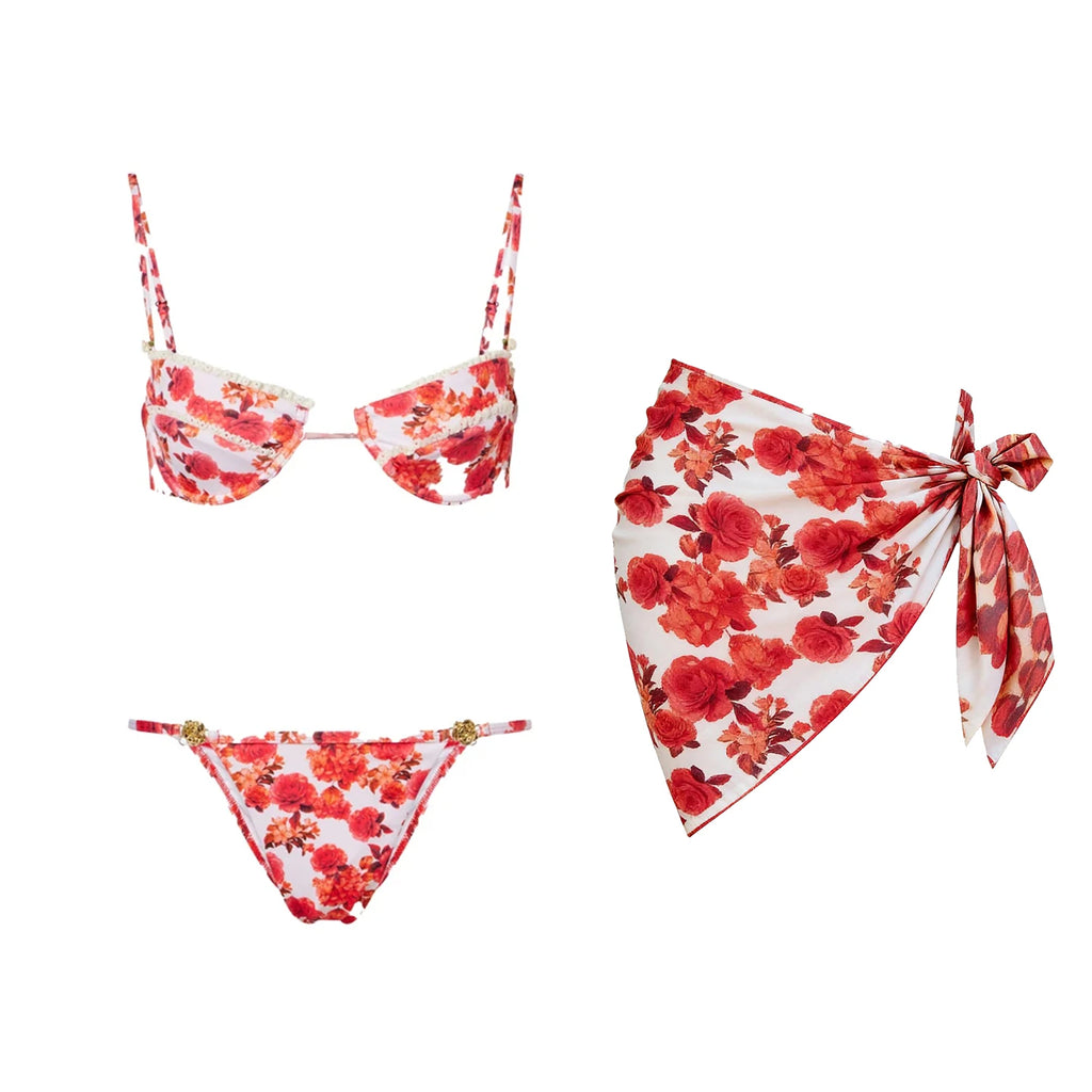 Red floral triangle micro bikini with matching floral sarong set on white background