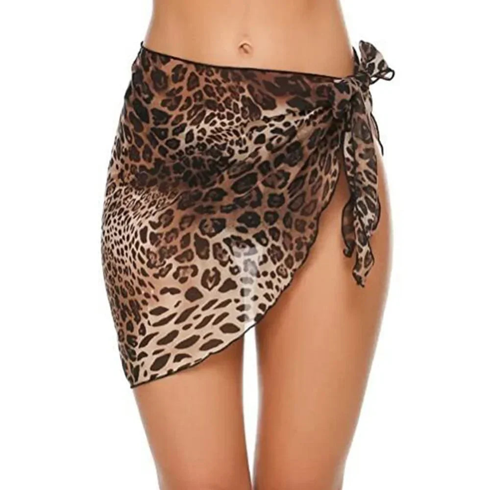 model wearing a leopard print chiffon sarong wrap tied at the front