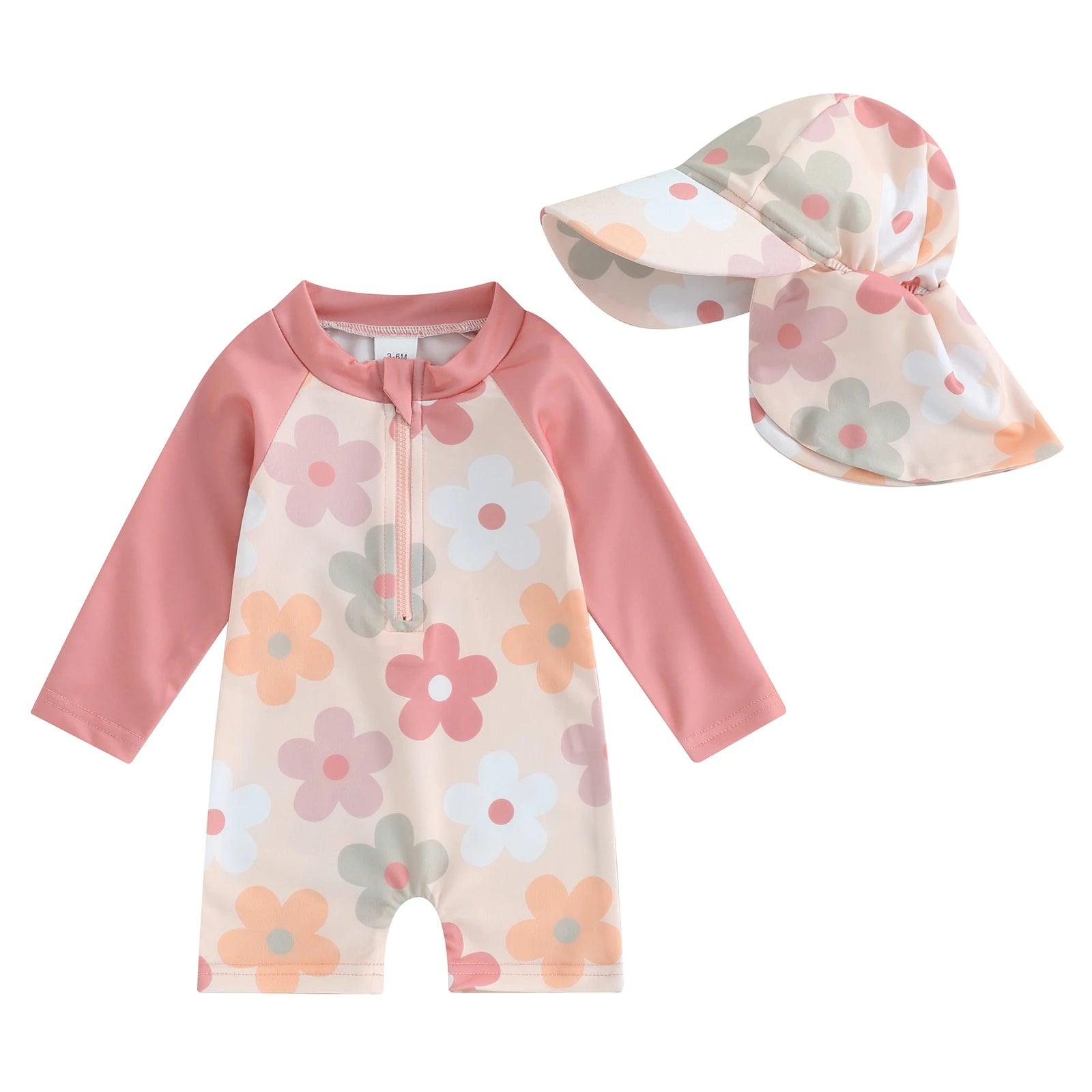 Toddler floral tropical long-sleeve swimsuit with matching pink and cream floral sun hat for sun protection