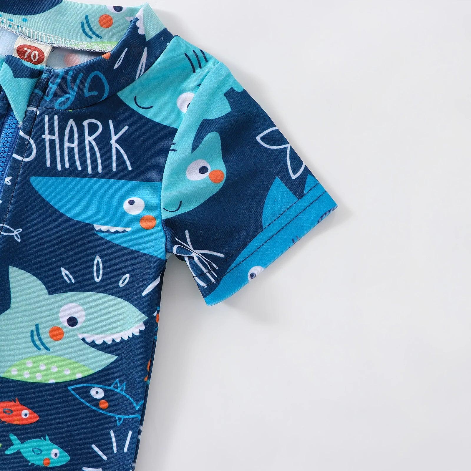 Toddler boys navy blue short sleeve one-piece swimsuit with shark and fish pattern and front zipper closure