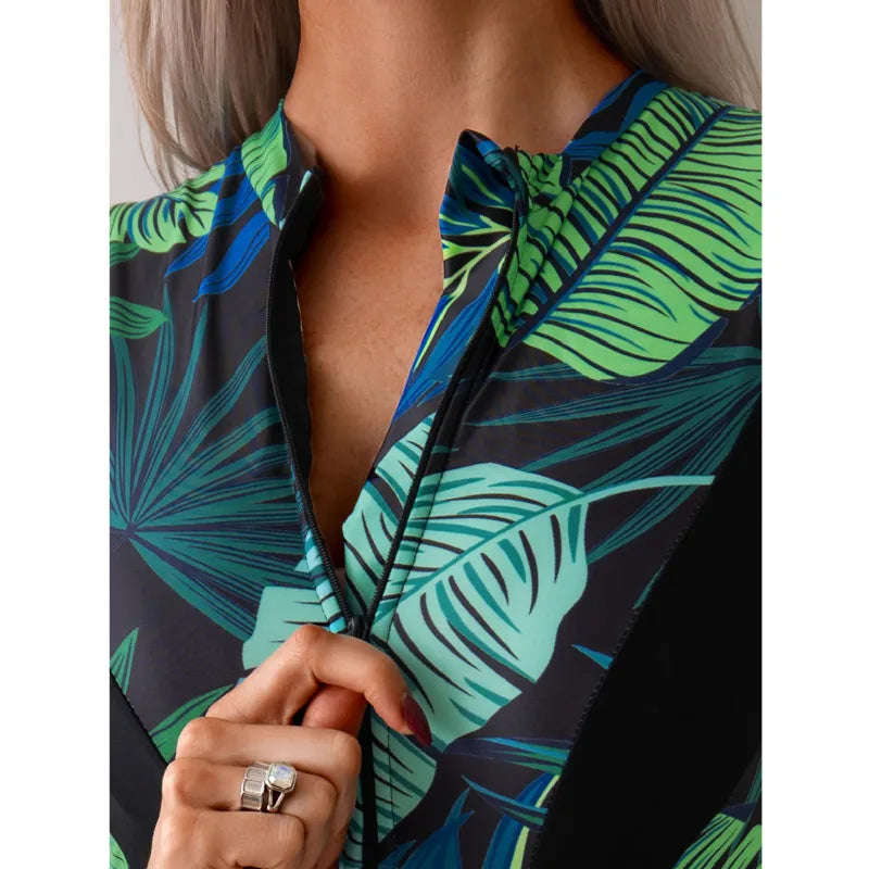 Tropical patchwork one-piece swimsuit with front zipper featuring green and blue leaf pattern and black side panels4