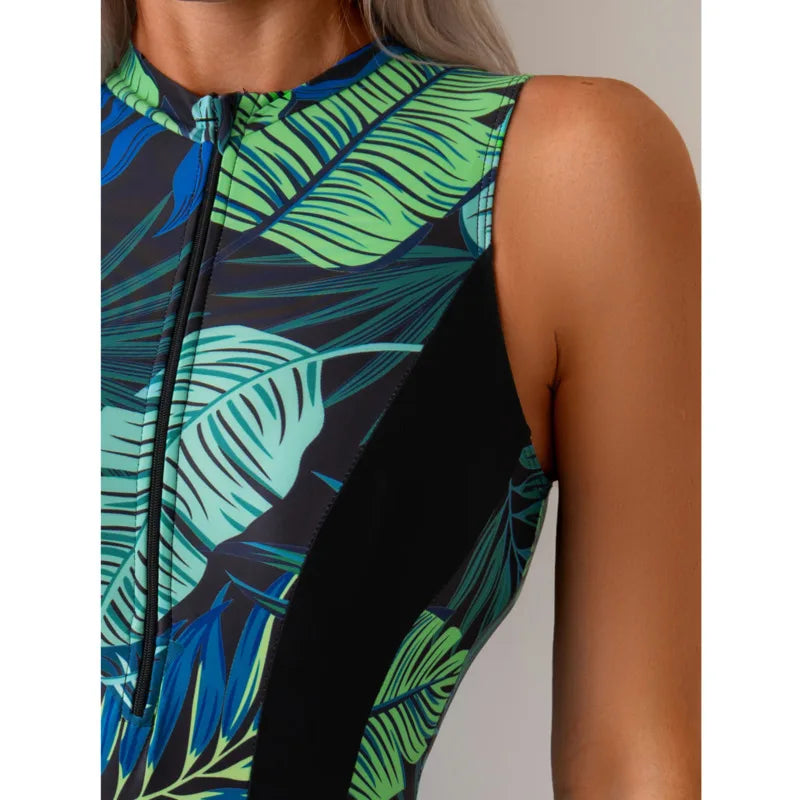 Tropical patchwork one-piece swimsuit with front zipper featuring green and blue leaf pattern and black side panels5