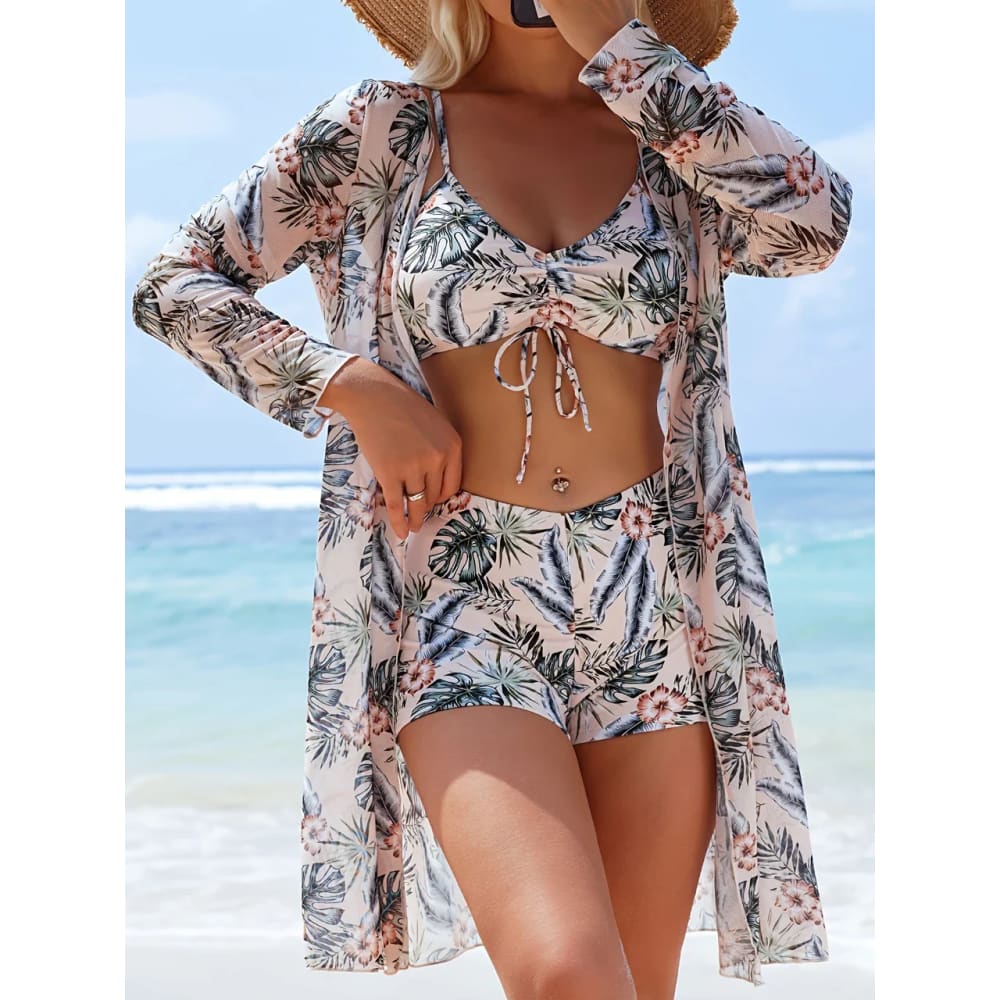 Beige tropical leaf and pink hibiscus print long-sleeved beach cover-up with flowing lightweight fabric for tie-dye bikini set