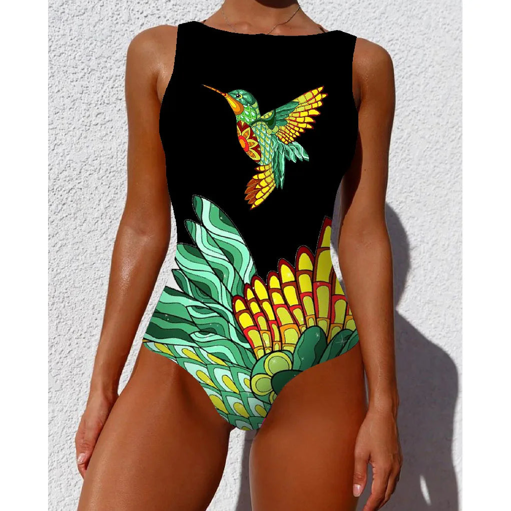 Black ethnic floral animal one piece swimsuit with vibrant hummingbird and tropical foliage design in green yellow and orange hues