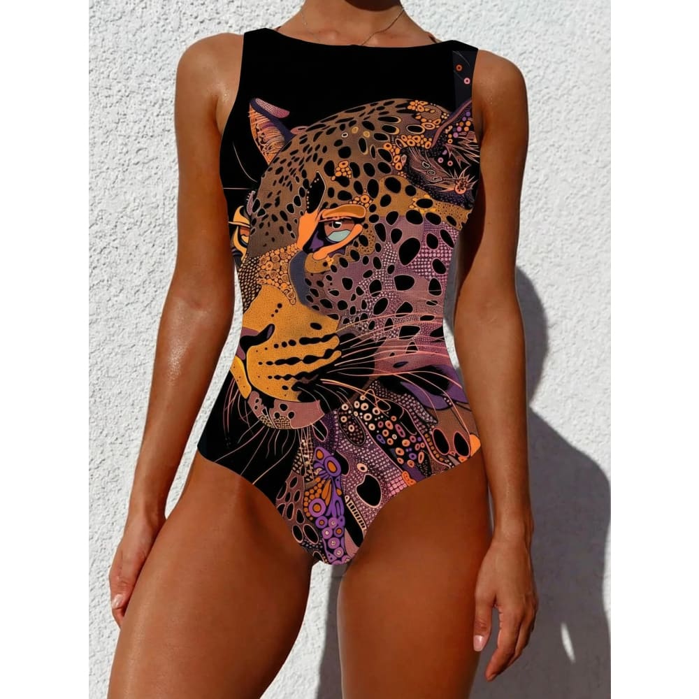 Black one-piece swimsuit with vibrant ethnic floral animal leopard print in orange purple and gold accents