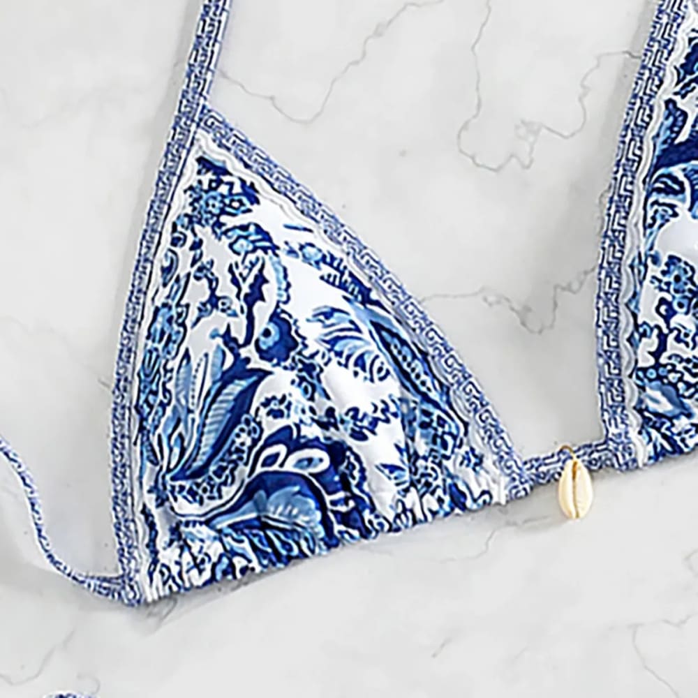 Blue and white patterned floral push-up triangle bikini top with greek key border in a bikini set with brazilian bottoms