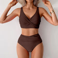 Brown two-piece women’s bikini with a cross-over push-up top and high-waisted bottoms made of stretchy fabric width 750px