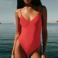 Red V-neck Brazilian one-piece swimsuit with thin straps