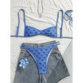 Blue floral triangle bikini top and high-leg bottoms set with matching trim